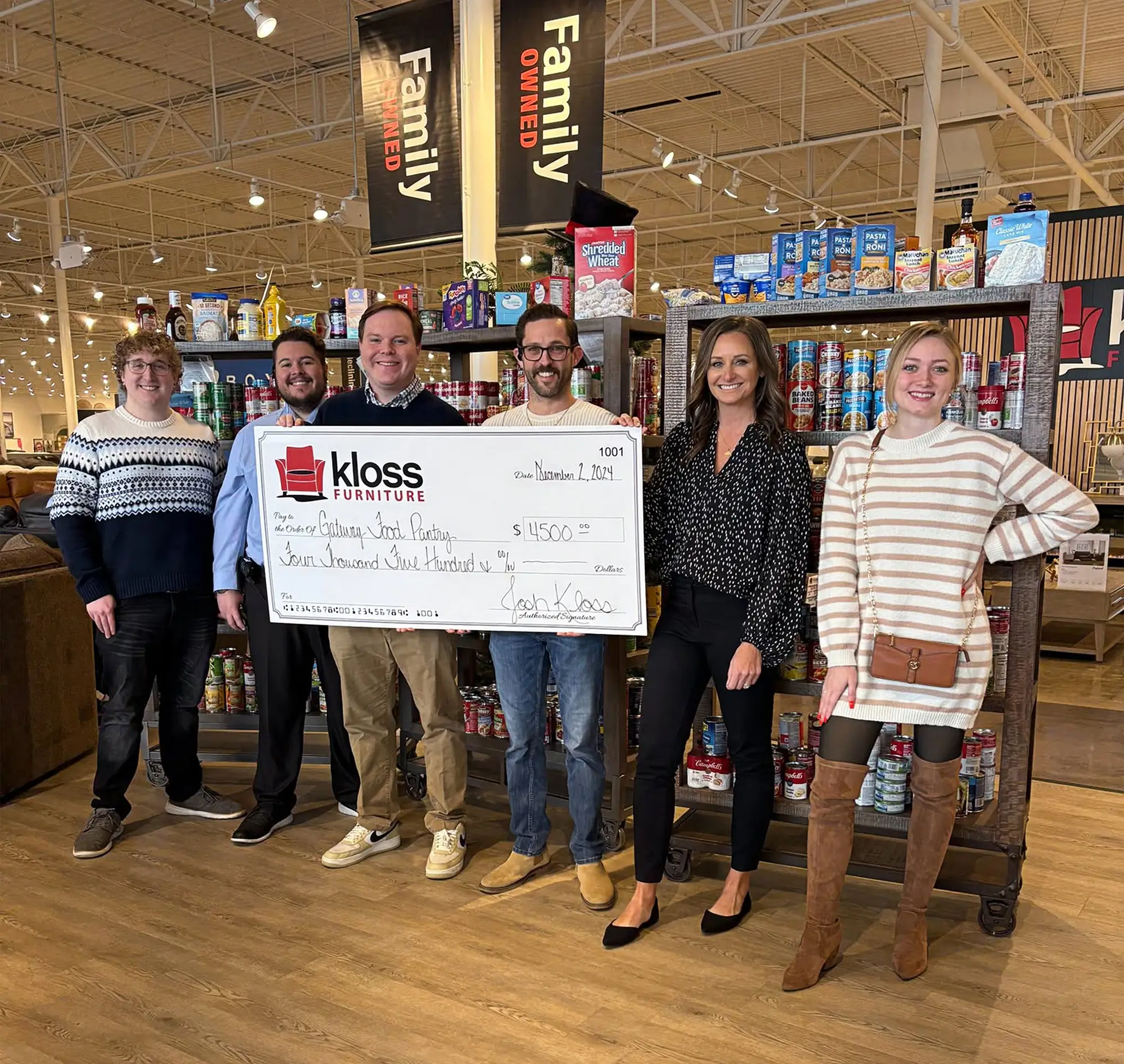 Kloss staff with a giant check
