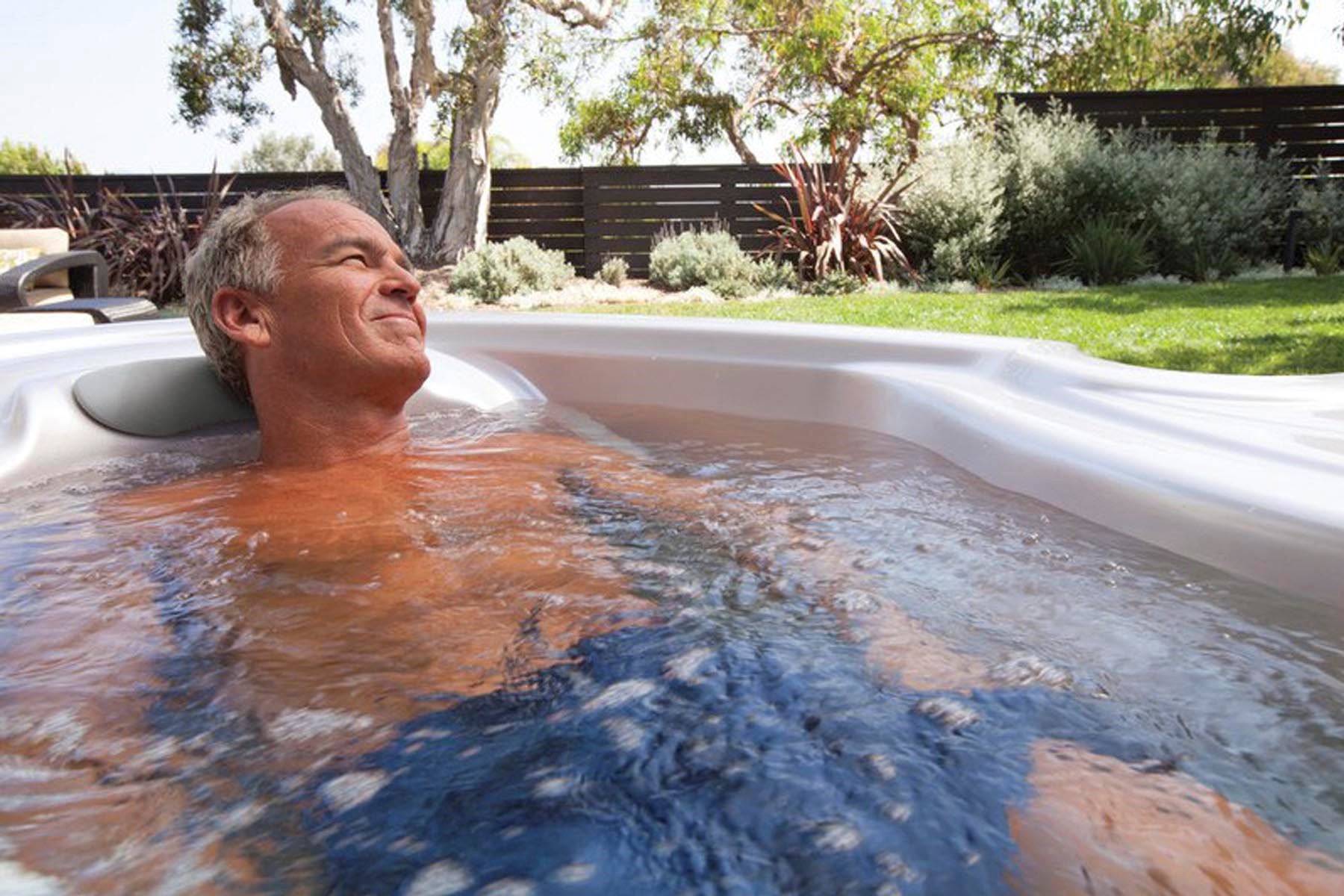 retired man enjoying a hot tub soak