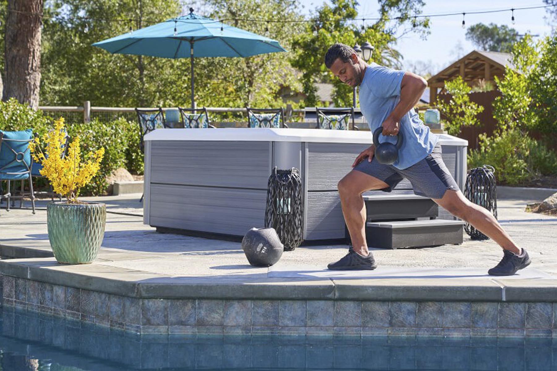 man working out by hot tub