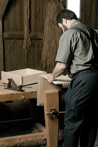 Man working on amish furniture